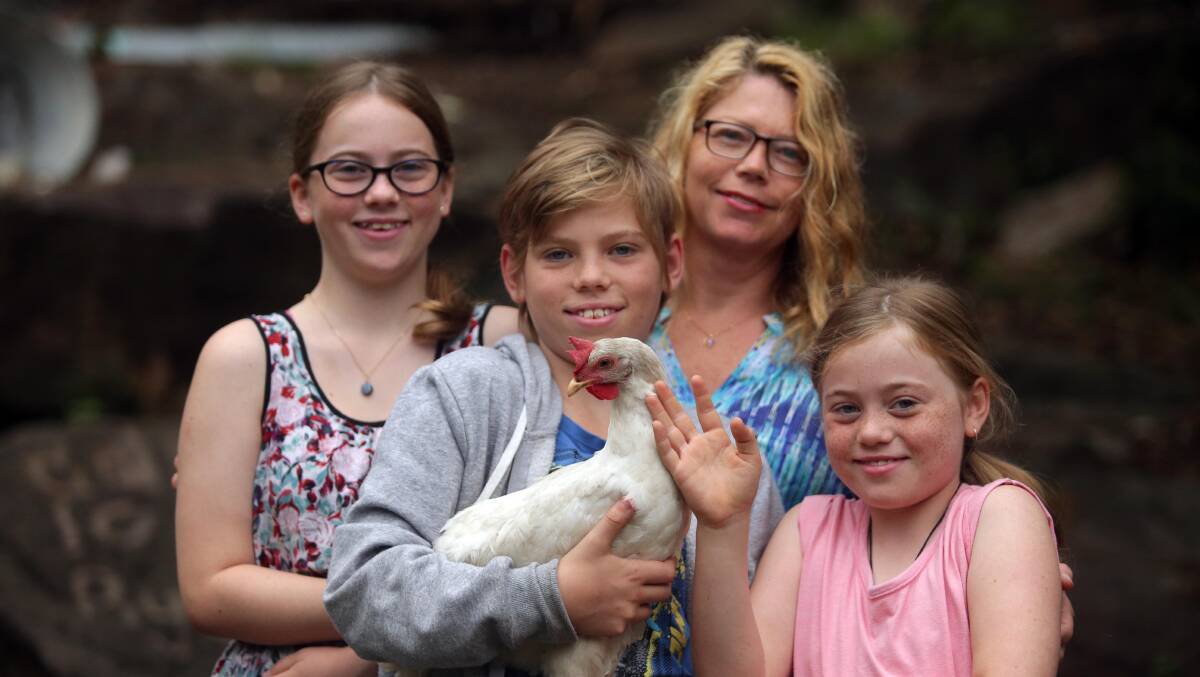 Trauma victim: Lucky is being cared for by Donna Dubois-Haberfield and her children Cassandra, 14, Ryan, 13, and Natalie, 10 at their Como home after surviving a fox attack. Picture: Chris Lane