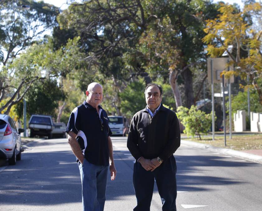 Development impact: Axel Tennie (left) and Tony Alaveras say the tree canopy in their street will be lost as more townhouses are built. Picture: John Veage