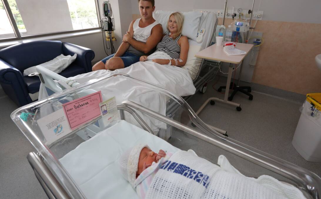 Food poisoning: Ashley and Kane Buchanan with daughter Ava, who was delivered by caesarean section. Picture: Kirk Gilmour.