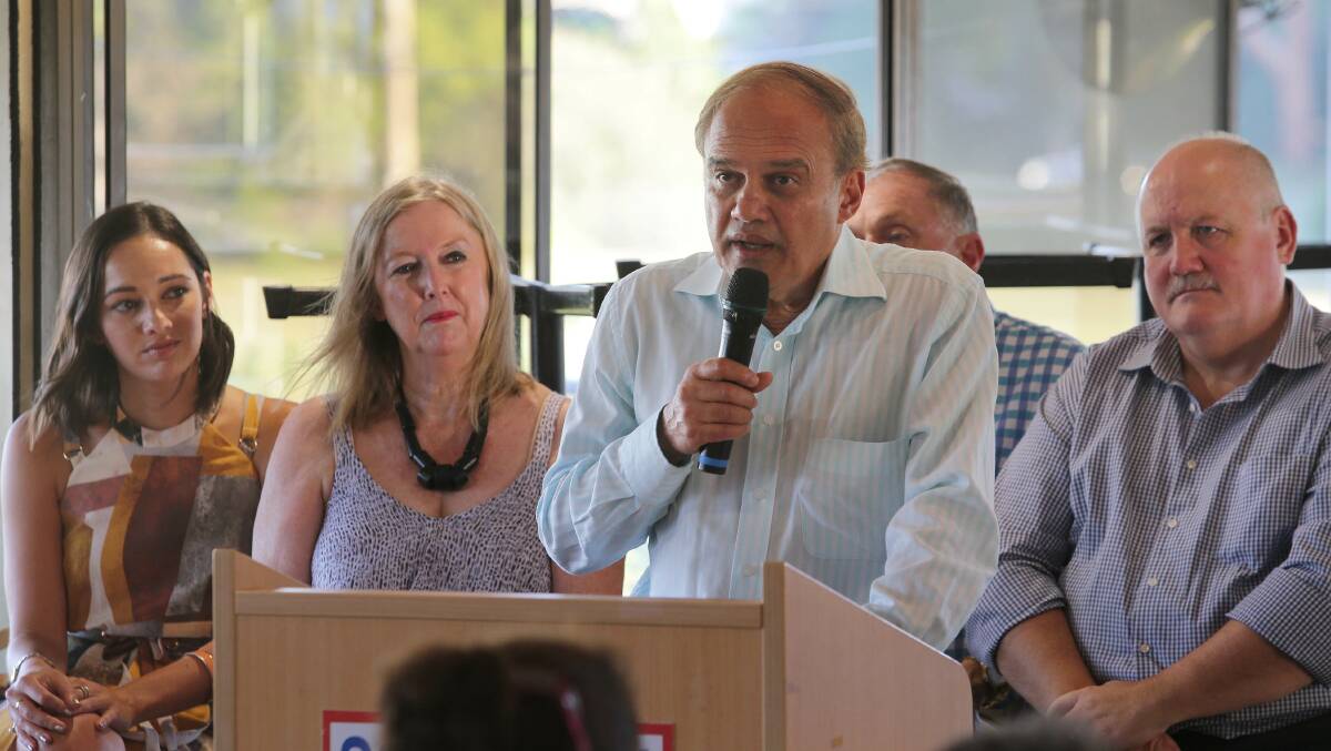 Dr Phadke speaks at the public meeting, supported by his wife Linda, daughter Alana, former Cronulla MP Malcolm Kerr and Heathcote MP lee Evans. Picture: John Veage
