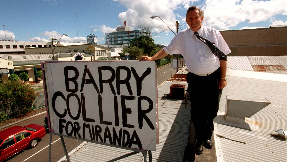 Political career: Barry Collier with a home-made sign above his campaign office in Miranda at the 1999 election. Picture: Steven Siewert