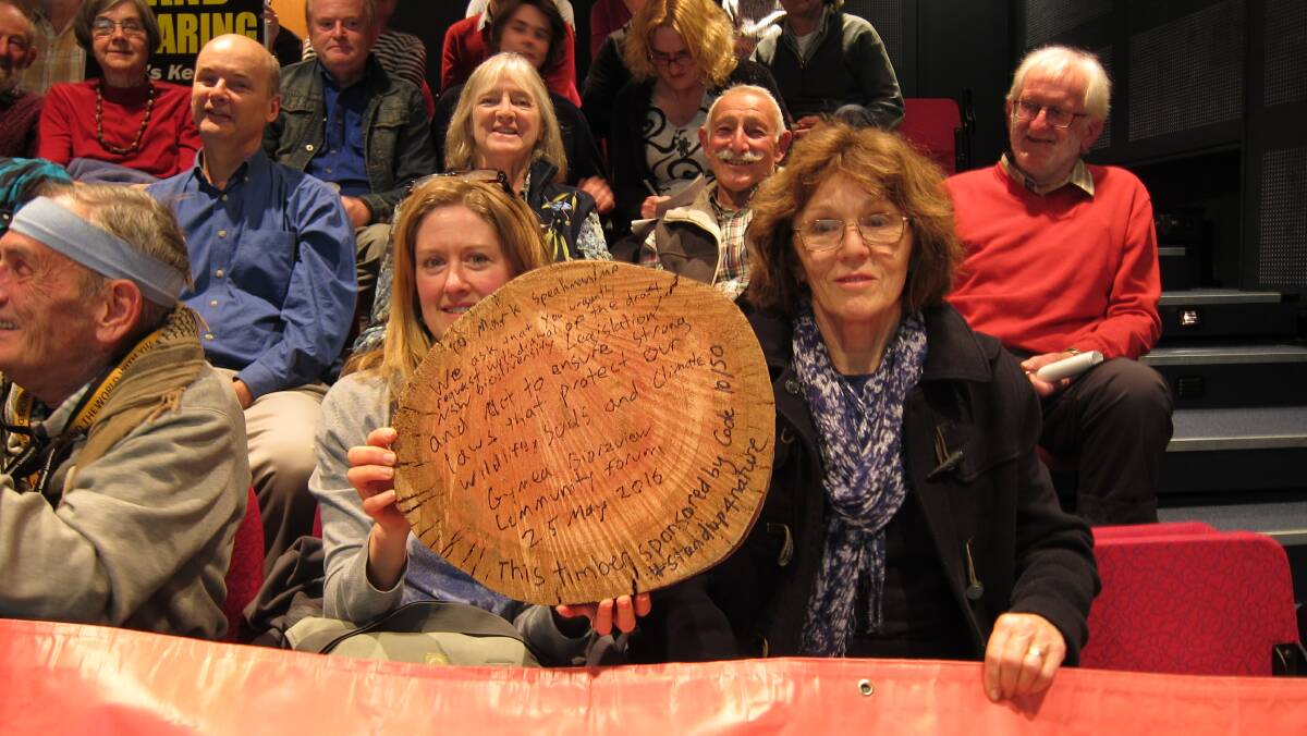 Message with a difference: Robbi Wymer and Pauline Duncan with woodcut message. Picture: supplied