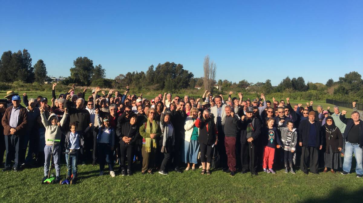 Fuming over F6: Some of the more than 150 residents who gathered near Civic Avenue, where an exhaust stack could be located. Picture: supplied