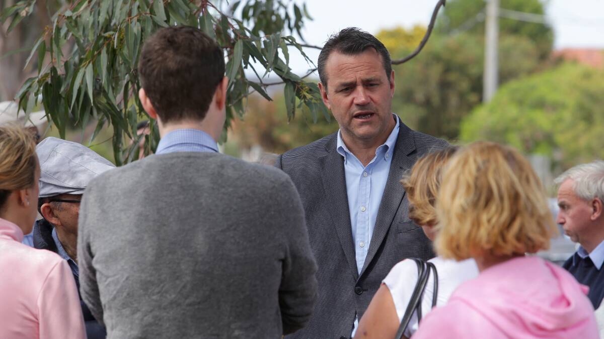 Rockdale MP Steve Kamper discusses the F6 extension with residents at a rally in 2017. Picture: John Veage