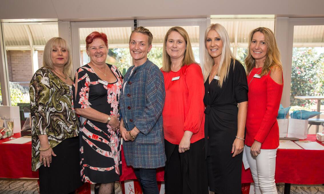 Team effort: Melissa Peel (left), Denise Dolan, Jen Armstrong and committee members Linda Hodges, Phoebe Judd, Karen Heapy at the Beauty Bank's Christmas in July high tea. Picture: supplied. 