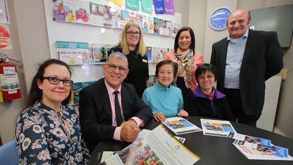 Seated:  John Ajaka and volunteers Sam Steele, Selina Lee and Hong Ma. Standing: Neighbourhood centre coordinator Danielle Finlay, operations manager Oonagh McGuire and board member Joe Notarangelo. Picture: John Veage