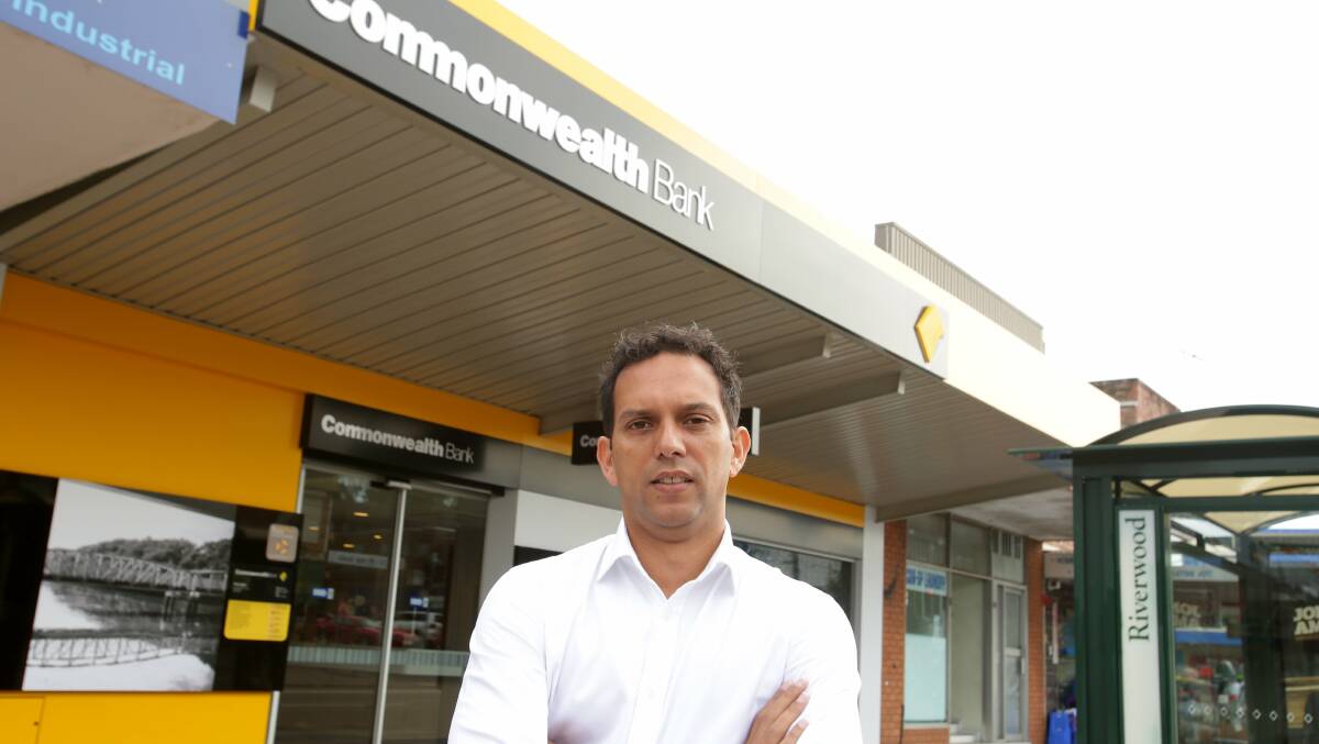 Special interest: Chris Gambian outside the Commonwealth Bank, Riverwood, near where his campaign office is located. Picture: Chris Lane