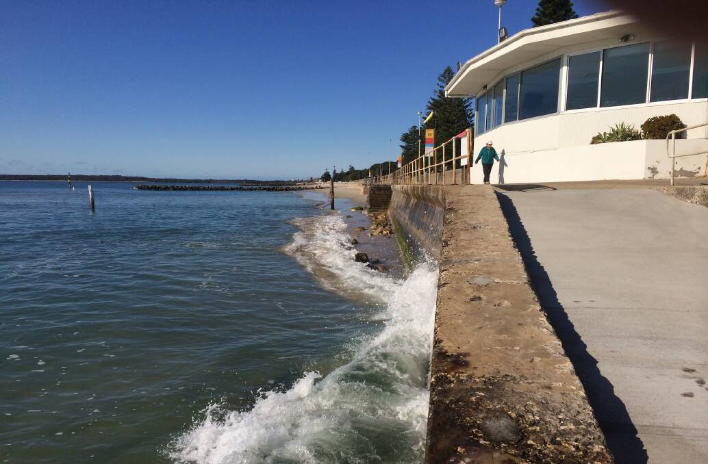 Waves pound the promenade at Ramsgate baths.