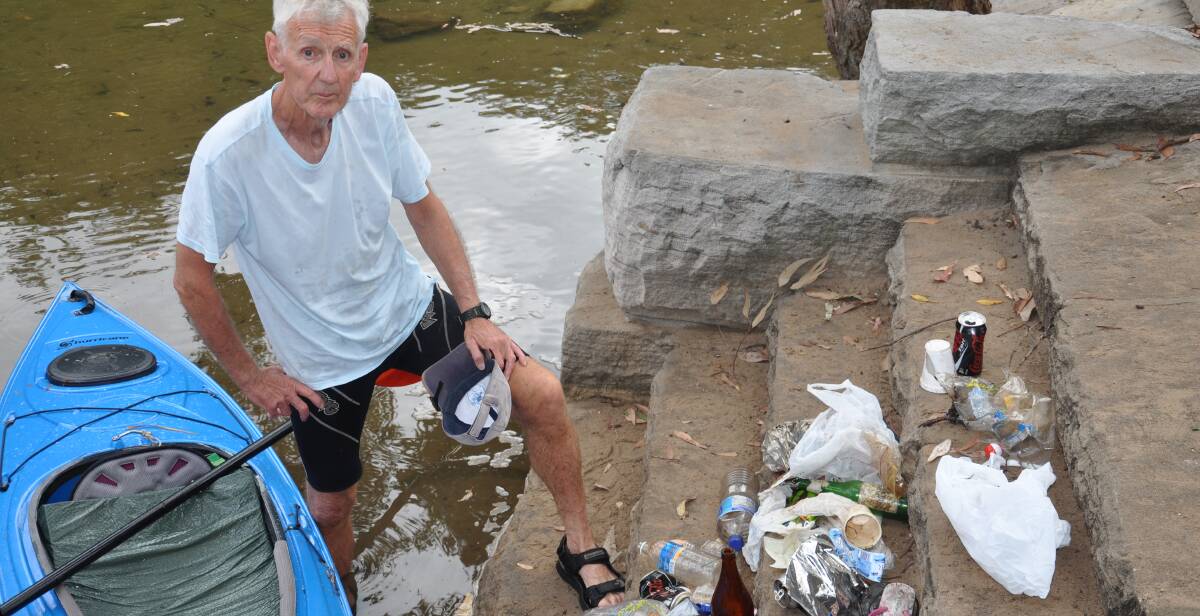 River of rubbish: Tom Grant with some of the litter he pulled from the Hacking River during a repeat exercise a fortnight later, which produced similar results.