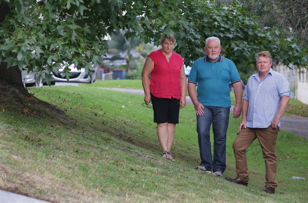 Footpath anger: Kevin and Chris Mackay, and  Craig Sheaves, who are opposed to plans for a footpath to be constructed in Matson Crescent, Miranda. Picture: John Veage