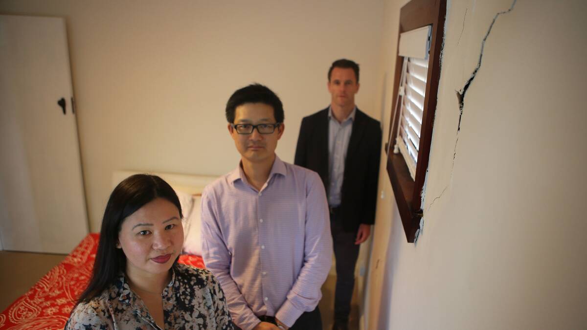 Safety fears: Christine and Allen Wong Wan Po, with Kogarah MP Chris Minns, next to a crack which runs from floor to ceiling. Picture: John Veage