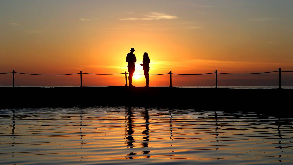 Tourism potential: Watching the sunrise from the Cronulla rock pool. Picture: John Veage
