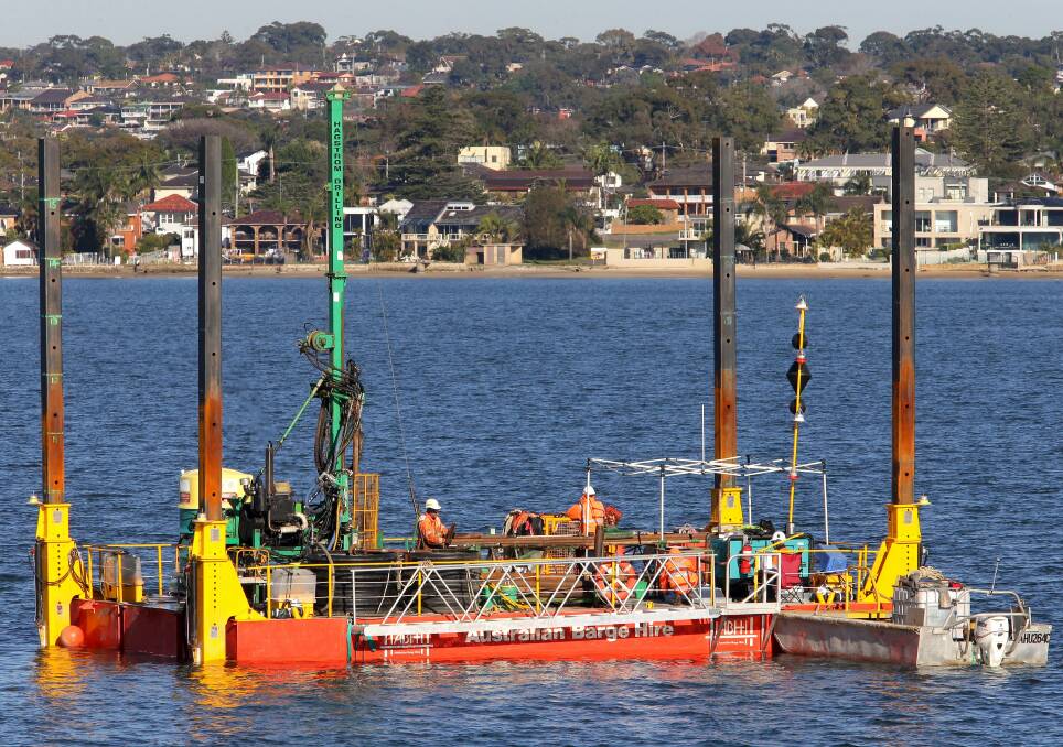 Construction delay fears: Geotechnical tests for the F6 in the Georges River last year before a further $20 million was allocated for planning. Picture: John Veage