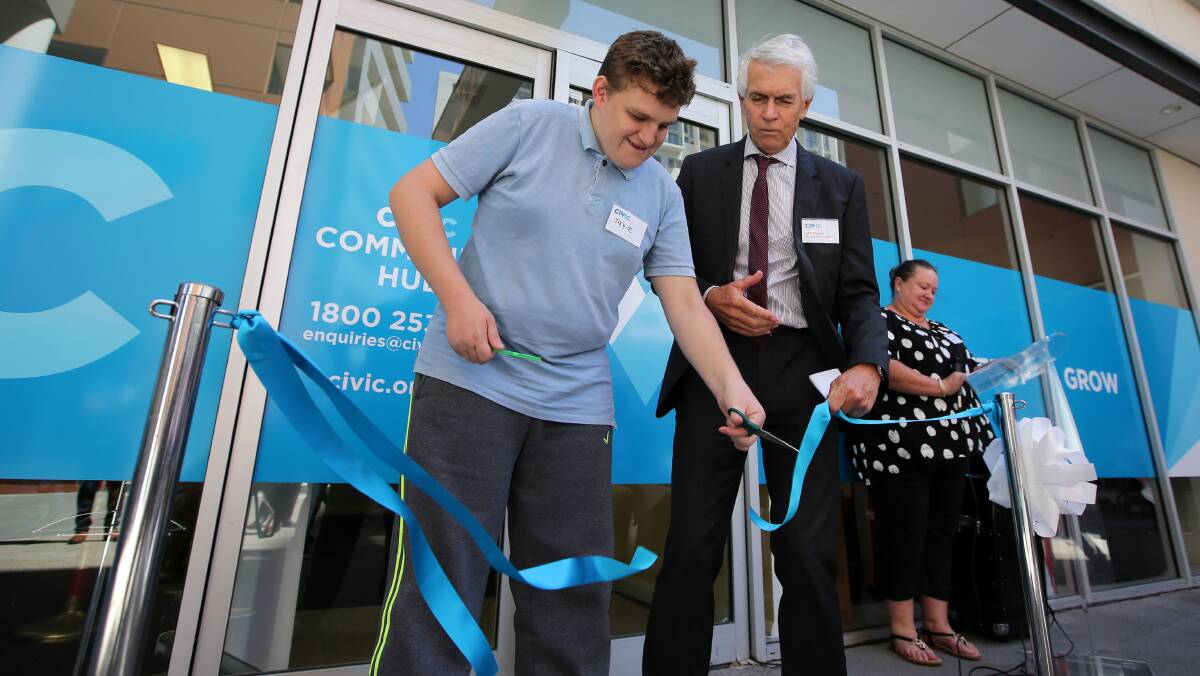 Civic client Jake cuts the ribbon to open the Hurstville Community Hub. Picture: John Veagew