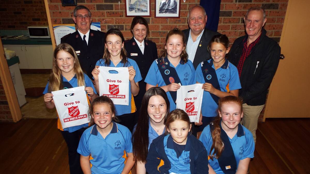 2nd Menai Girl Guides with Ian Spall (left), Major Kerry Spall, Lee Evans and Russell Smith.  Picture: supplied