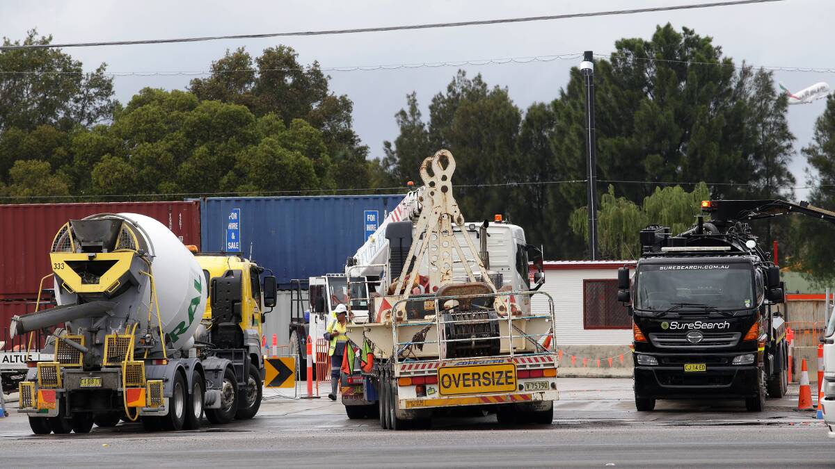 Tunnel work starts: A crane truck carrying over-size machinery enters the work site on Kogarah Golf Course from Marsh Street, Arncliffe. Picture: John Veage