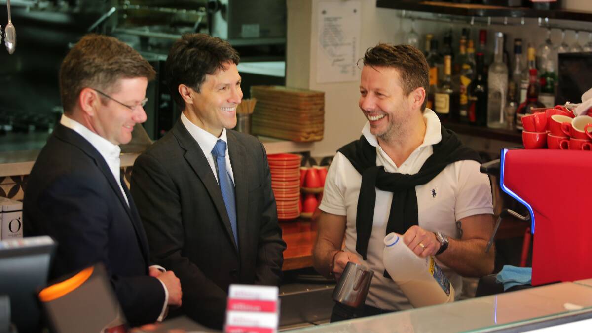 Program announcement: Oatley MP Mark Coure (left), Victor Dominello and cafe owner David Bitton. Picture: John Veage
