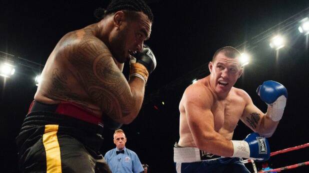 Fight night: Paul Gallen goes toe to toe with Junior Paulo at Moore Park. Photos: Christopher 
Pearce
