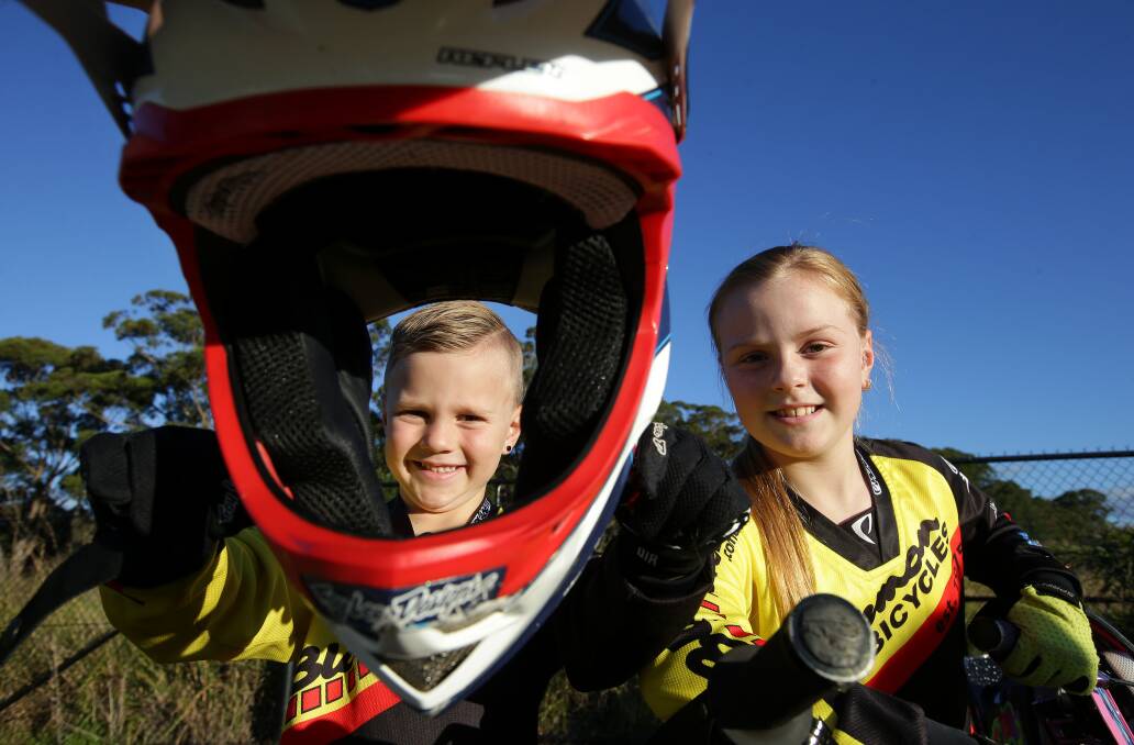 BMX bandit: Bradshaw siblings Harley, 6, and Milan, 8, from Illawong, are all smiles now that council has committed $250,000 to build a BMX track at Barden Ridge. Picture: John Veage