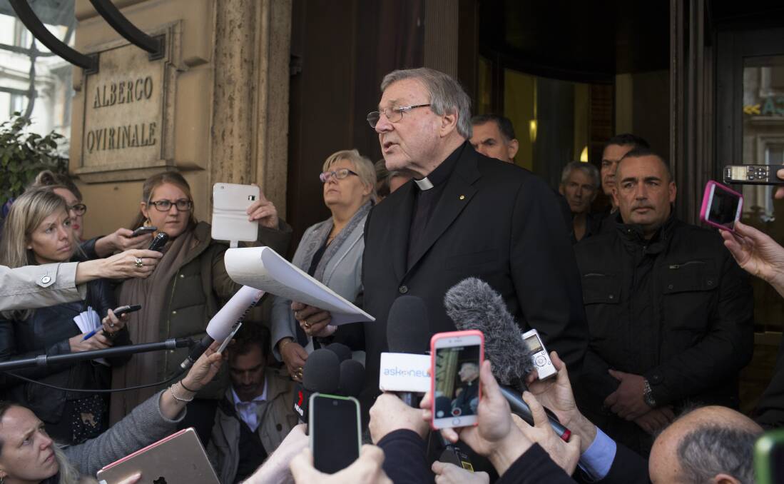 Under fire: Cardinal George Pell reads a statement after a meeting at the Quirinale Hotel with the victims of child abuse. Picture: Getty Images