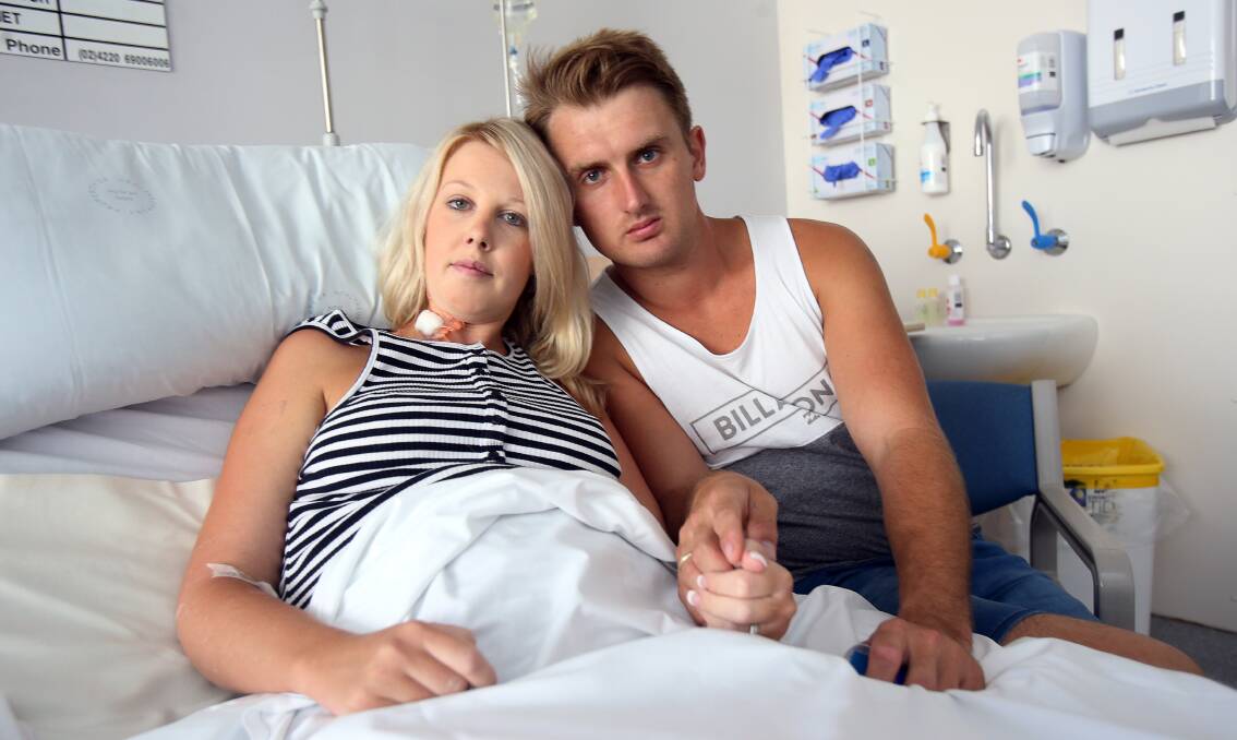 Parents Kane and Ashley Buchanan pictured after Ashley's emergency caesarean after contracting food poisoning from a Sylvania bakery. Picture: Kirk Gilmour