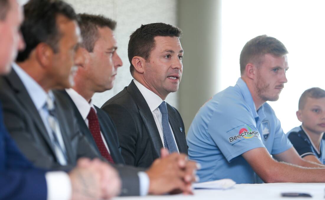 Sydney FC Chairman Scott Barlow (centre) speaking at WIN Stadium in Wollongong for an announcement of a partnership between Sydnery FC and the Wollongong Wolves. Picture: Adam McLean