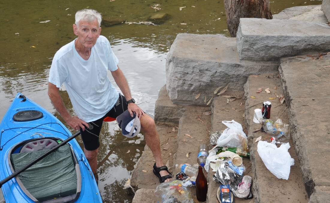 River of rubbish: Tom Grant with some of the litter he pulled from the Hacking River during a repeat exercise a fortnight later, which produced similar results