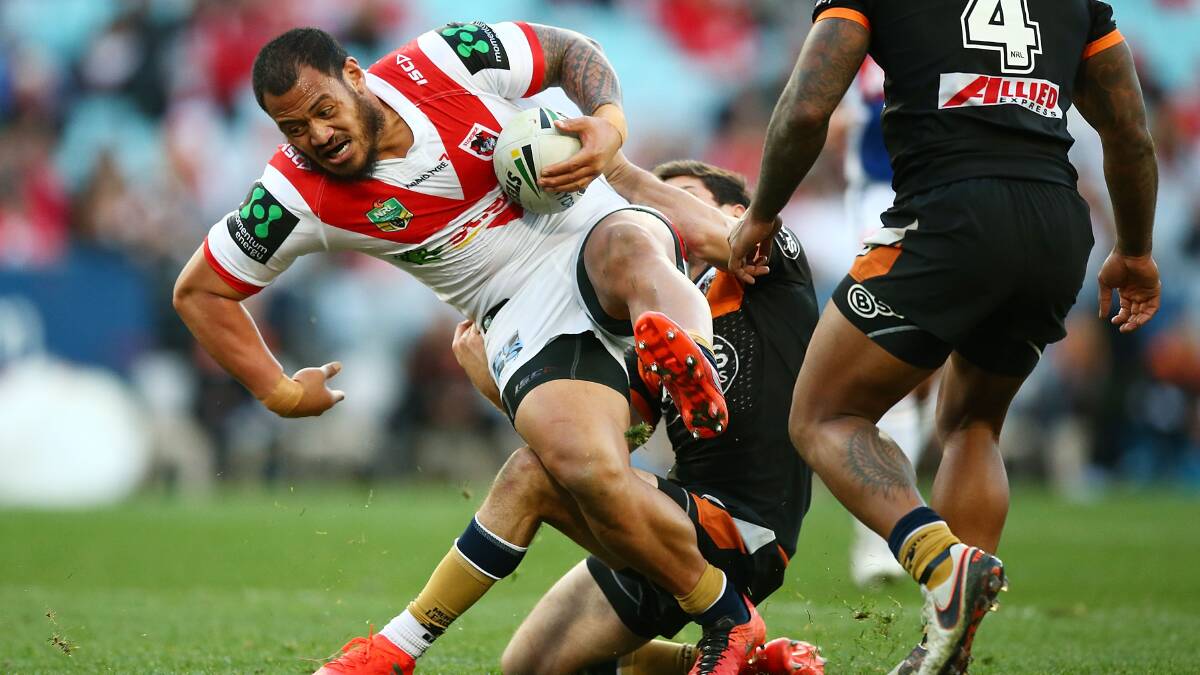 Suspended: Leeson Ah Mau of the Dragons is tackled during the clash with Wests Tigers at ANZ Stadium on Sunday. Photo: Mark Nolan/Getty Images
