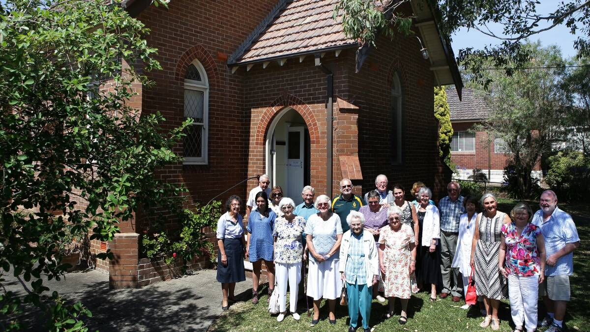Sad to lose their church: Members of the South Cronulla congregation stand outside their church which has been listed for sale.