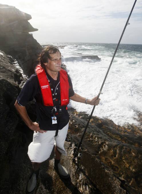 Potter Point, Kurnell, the location of this morning's rescue. Pictured is ANSTO's  Tom Loosz in 2012 during a fish survey at the popular but dangerous fishing spot. Picture: Anna Warr