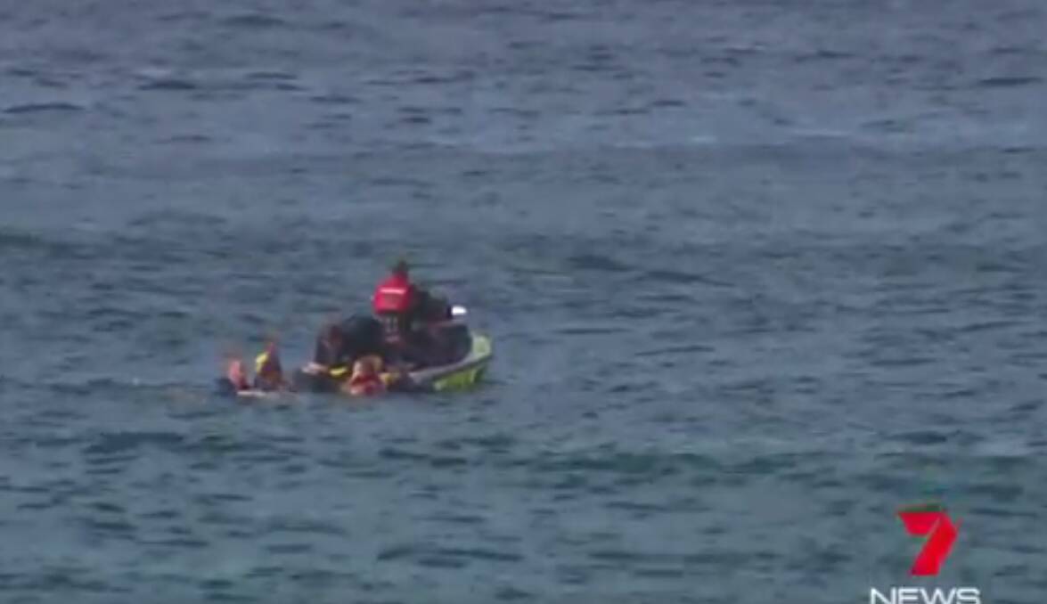 Rescue: A surfer who hit his head on a reef off Cronulla has suffered head and suspected spinal injuries. Picture: 7 News