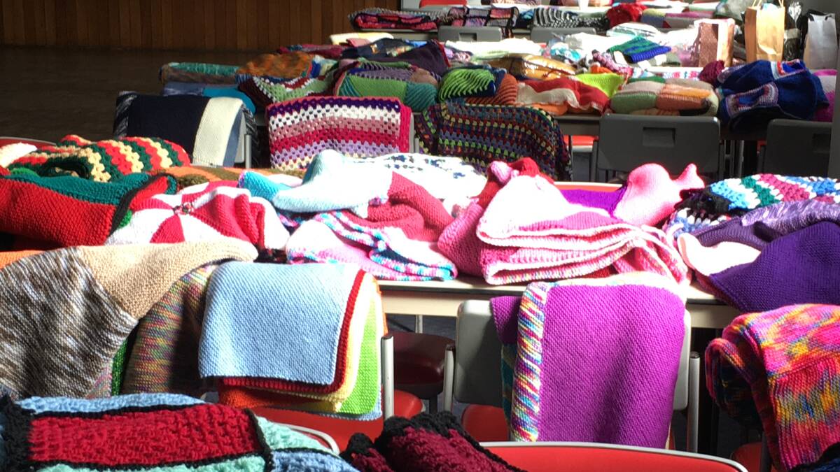 Keeping the chills away: Part of the vast array of winter woolies knitted by the members of the Hurstville Ladies Probus Club.