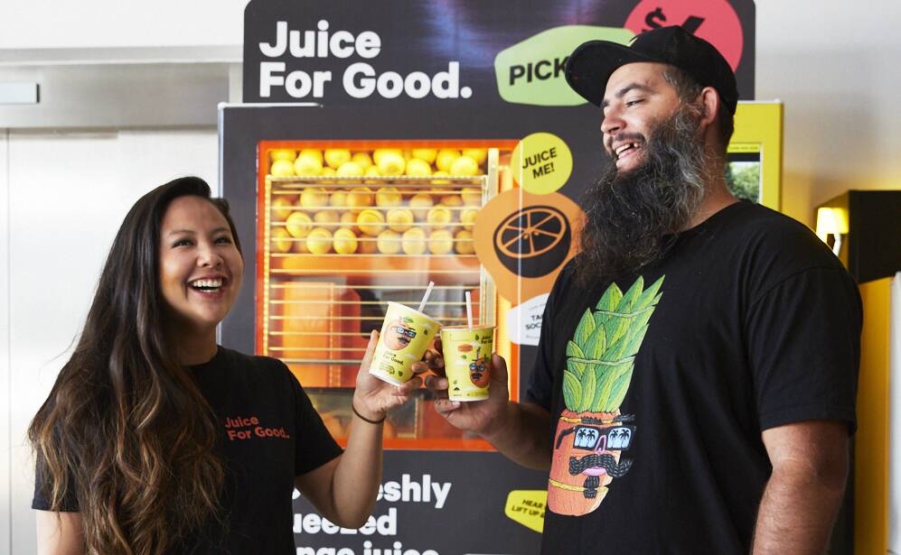 Collab: Louise Tran head of marketing at Juice For Good with Joel Moore 'aka Mulga' and the new juice cups. Picture: Supplied
