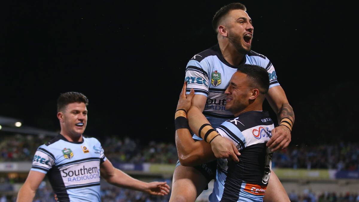 How sweet it is: Cronulla players celebrate one of the gutsiest wins in the club's history. Pictures: Getty Images