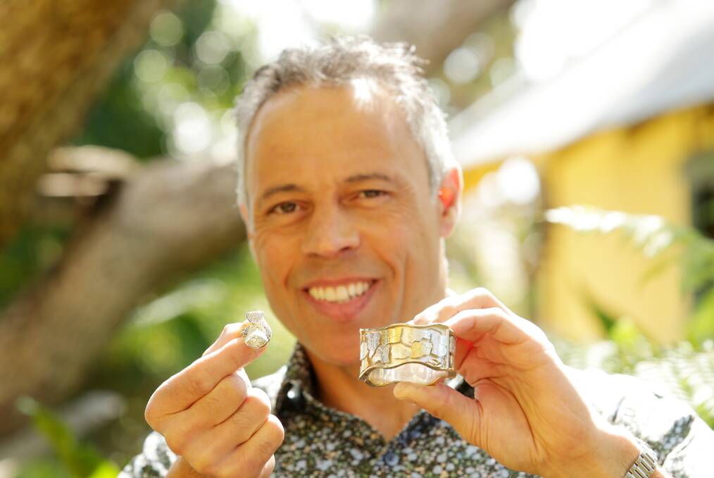 Naturally inspired: Gary Thyregod holds his winning design, a ring called Tie the Knot, and his son Hugh's winning design, a bracelet inspired by the bark of a tree. Picture: Chris Lane