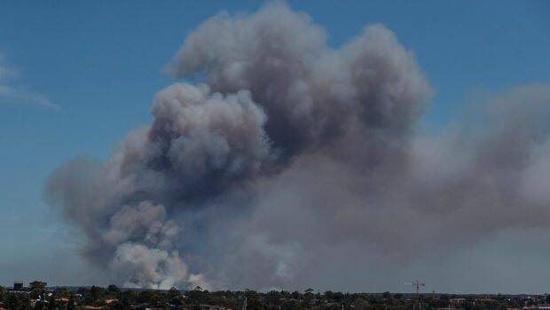 Smoke visible from Captain Cooks Bridge, rising off an out-of-control bushfire burning in the Royal National Park.  Photo: Brook Mitchell
