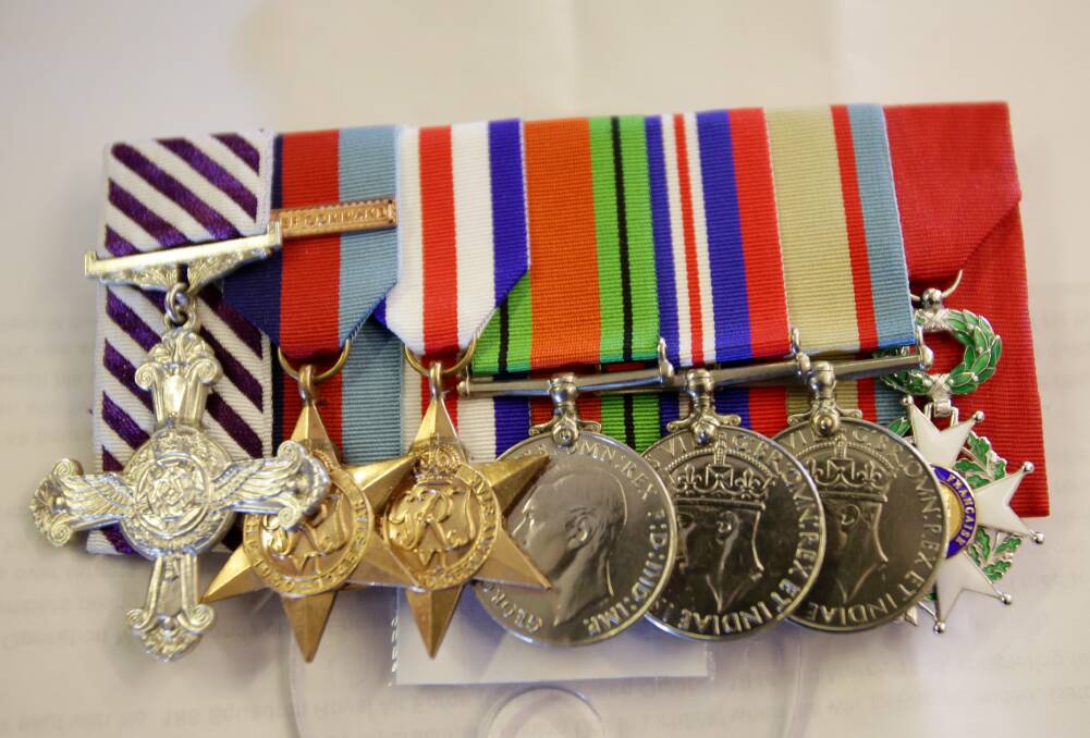 Recognition: Mr Barton’s medals include the Distinguished Flying Cross, on the left and the French Legion of Honour on the right. Pictures: Chris Lane
