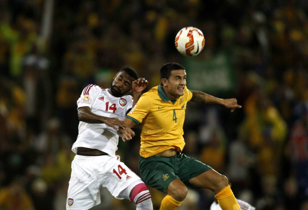 Jumping Socceroo: Tim Cahill heads the ball in the AFC Asian Cup semi-final 2-0 win over UAE at Hunter Stadium. Picture: Darren Pateman.
