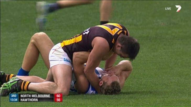 Hawthorn defender Brian Lake clashes with his opponent Drew Petrie. Photo: Channel Seven