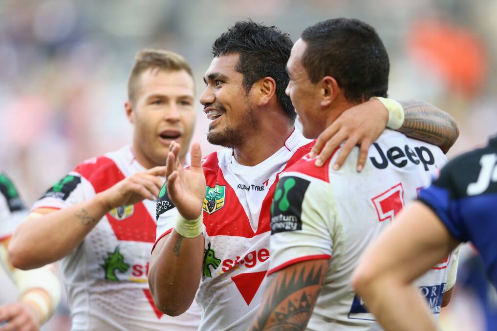 Time to celebrate:  Trent Merrin (left) and Peter Mata’utia (centre) congratulate Tyson Frizell after his try in Sunday’s game.  Pictures: Mark Kolbe, Getty Images
