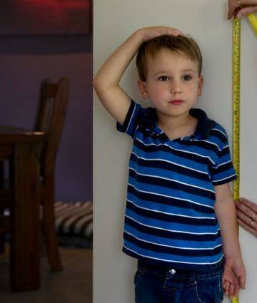 Measuring your child's height is a simple maths activity. Photo: Edwina Pickles