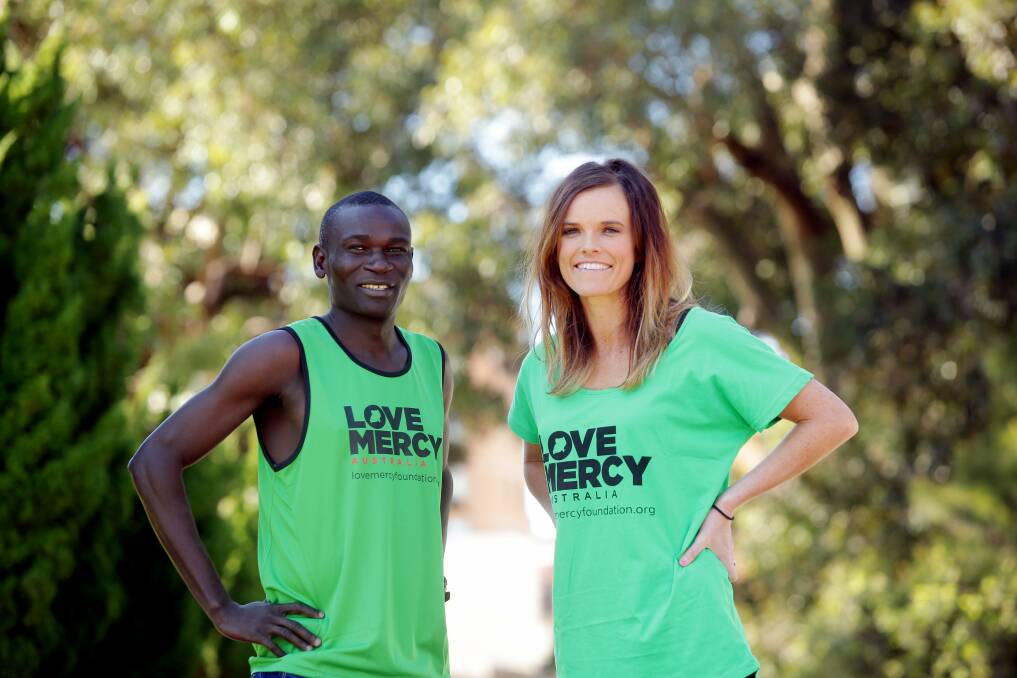 Home turf: Cronulla runner Eloise Wellings (right) will take on Sunday's Sutherland 2 Surf with Ugandan dual Olympian Julias Achon. Picture: Chris Lane