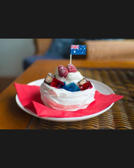 'Here is my Australia Day pavlova creation. It is a cross between a trifle and a pavlova - I'm calling it a Triflova! Individual pav base with vanilla custard, raspberry and blueberry jelly cubes and lamington squares then finished off with a dollop of fresh cream & raspberries.' Photo: Facebook/Christine Yates