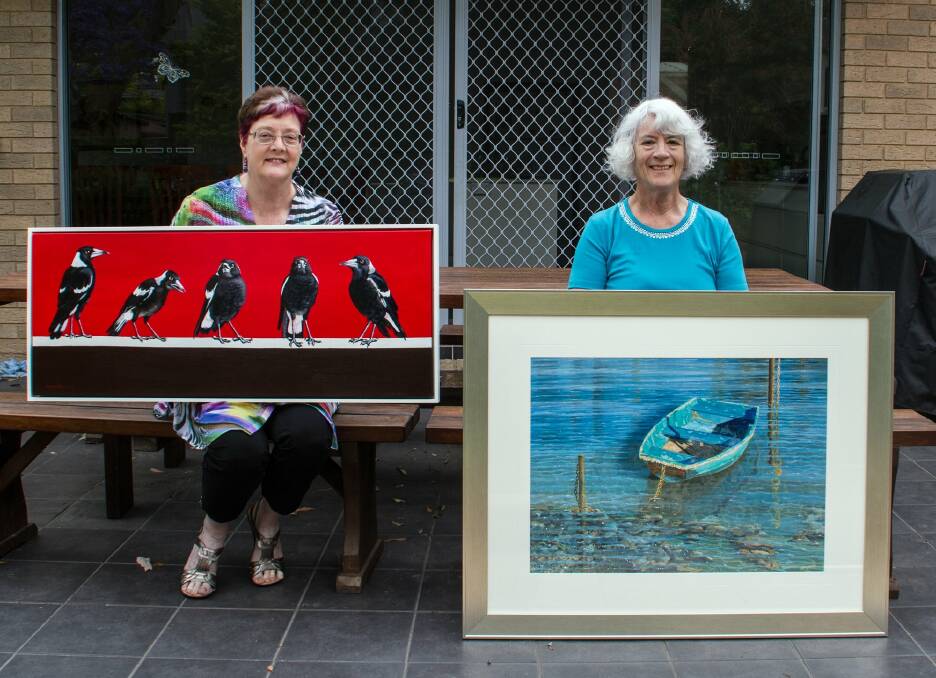 Donated art: Oatley 101 artists Geraldine Taylor (left) with The Morning Shift and Freda Surgenor with Close to Shore.