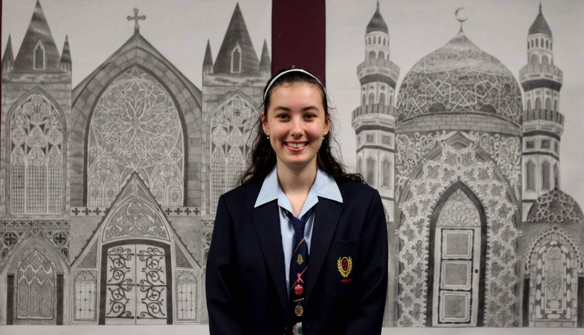 Creativity on show: Medina Krcic with her work, which was exhibited at Moorefield Girls High School's art festival. Picture: Chris Lane