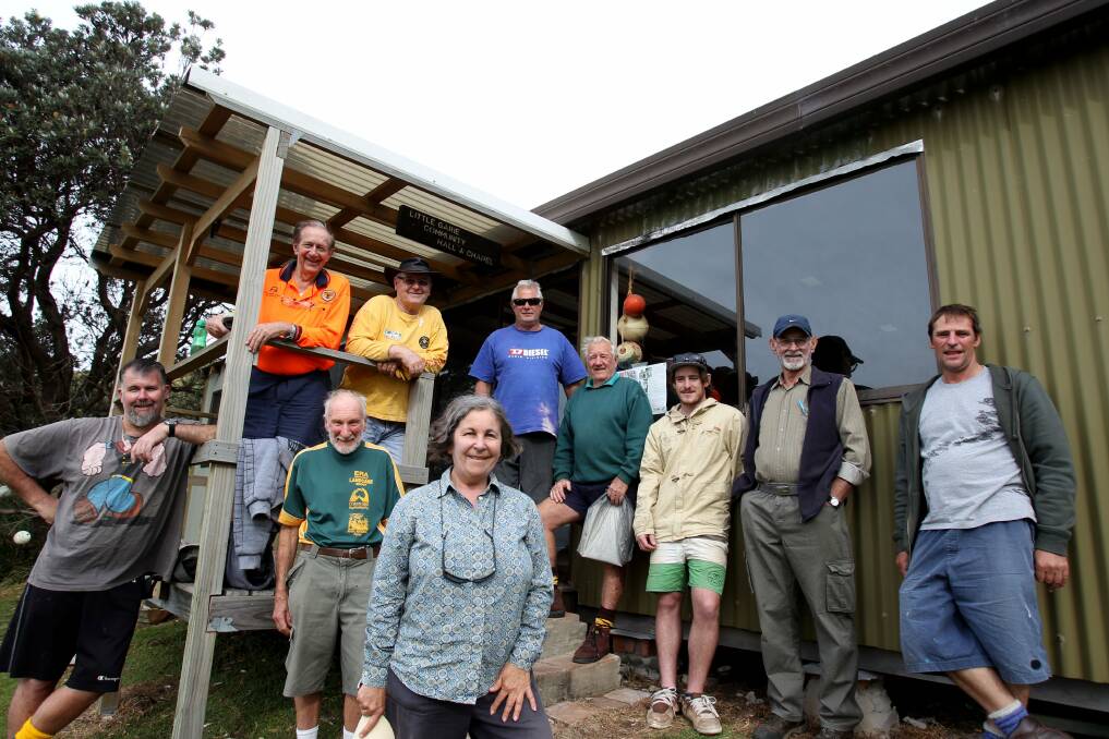 Recognition: The community behind saving the park's shacks has received an award. Helen Voysey is in the front of the photo. Picture: Chris Lane
