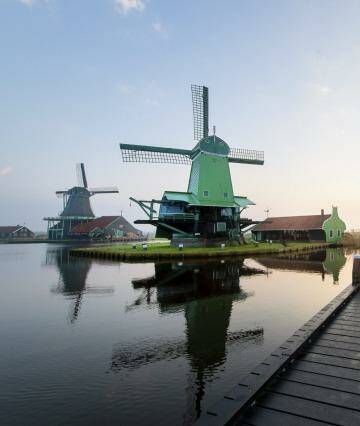 Typical scene: Traditional Dutch windmills at the Zaanse Schans in The Netherlands, seen from a yetty. Photo:  iStock