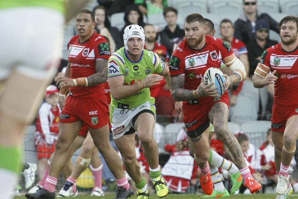 Doin’ the Dugan dance: Dragons fullback Josh Dugan (with ball) had another strong game in the No.1 jersey against his former club, Canberra Raiders. Pictures: Christopher Chan
