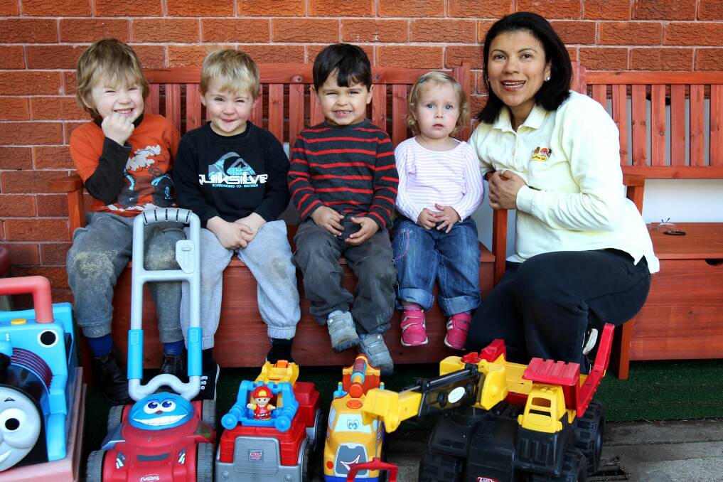 Family first: Early childhood educator Magda Sanchez with Malachi, Tyler, Thomas and Ebony. Picture: Jane Dyson