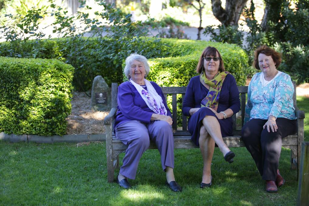Lean on me: Valda Hamilton, Gail Terrey (centre) and Jenny Wandel at the Compassionate Friends rose garden.Picture: John Veage